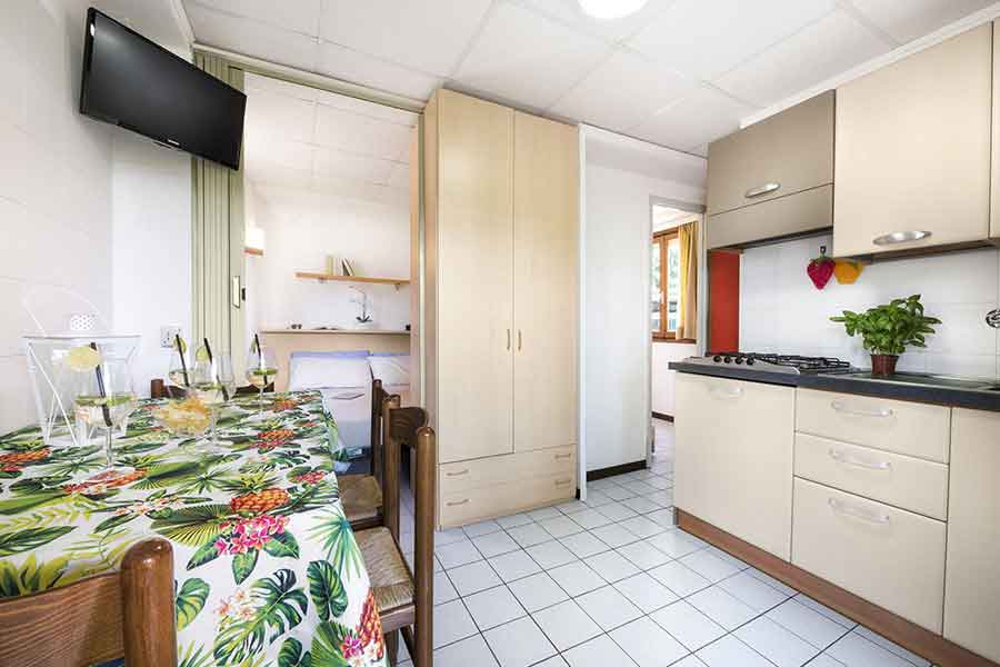 Living room-kitchen of the bungalow with a view of the double bedroom