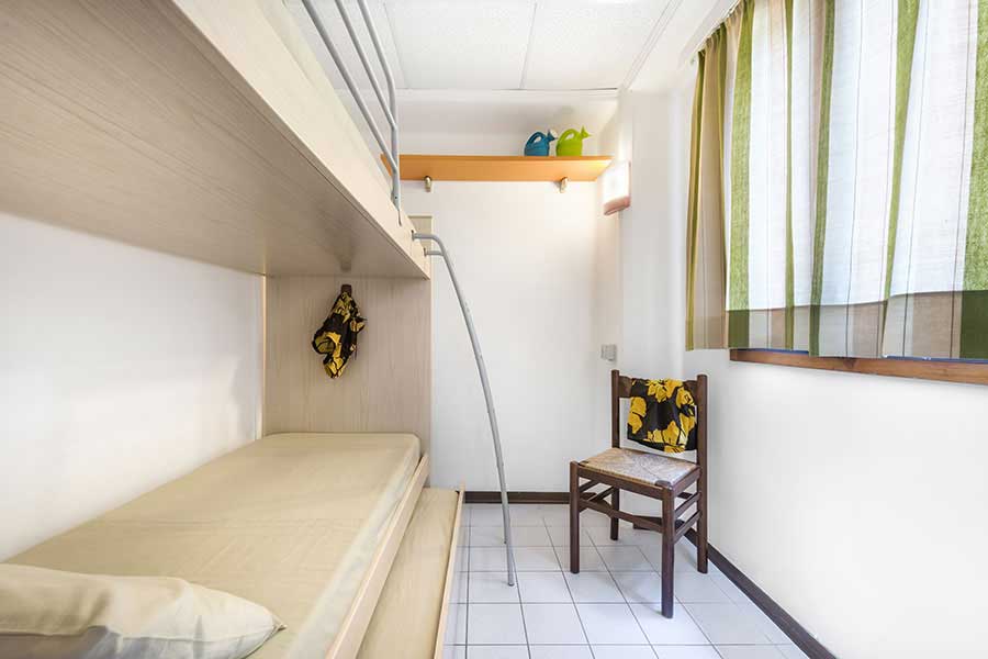 Triple bedroom with single bunk beds